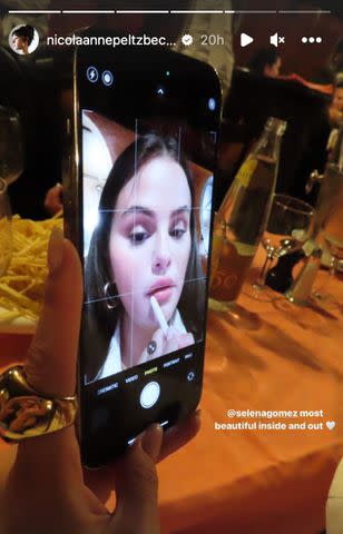 <p>Nicola Peltz Beckham/Instagram</p> Nicola Peltz shares image of Selena Gomez doing her makeup at dinner to Instagram