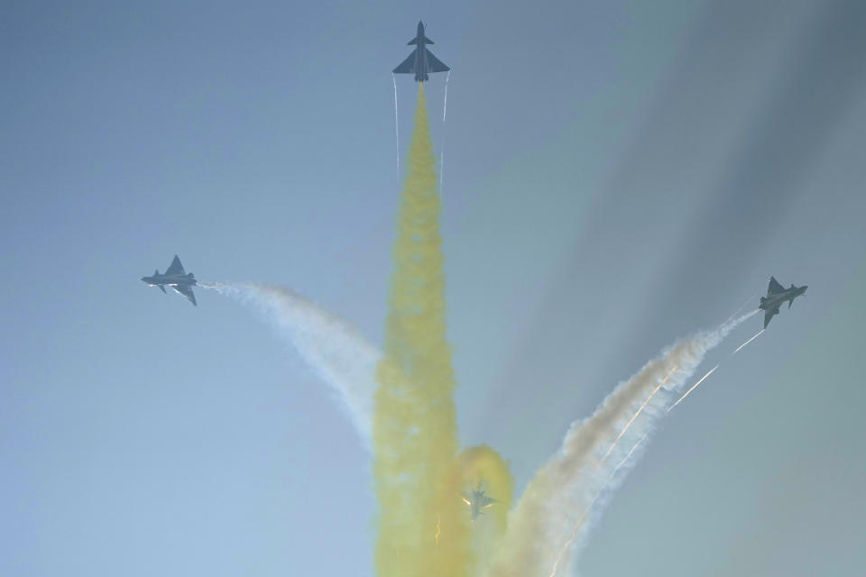 Members of the "August 1st" Aerobatic Team of the Chinese People's Liberation Army (PLA) Air Force perform during the 13th China International Aviation and Aerospace Exhibition, also known as Airshow China 2021, on Tuesday, Sept. 28, 2021, in Zhuhai in southern China's Guangdong province. (AP Photo/Ng Han Guan)