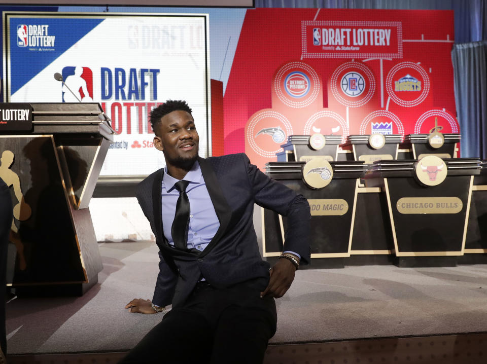 Deandre Ayton relaxes before the NBA draft lottery Tuesday night. (AP)