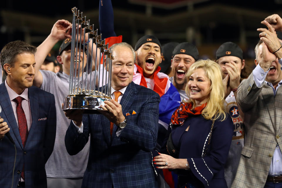 Astros owner Jim Crane hoists the 2017 World Series trophy. (Photo by Alex Trautwig/MLB via Getty Images)