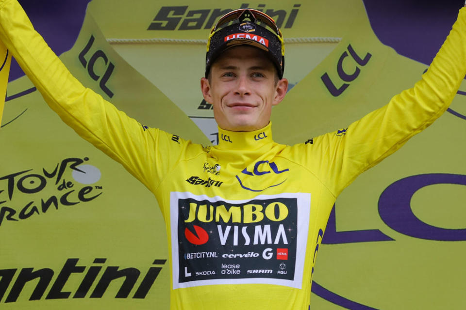 JumboVismas Danish rider Jonas Vingegaard celebrates on the podium with the overall leaders yellow jersey after the 8th stage of the 110th edition of the Tour de France cycling race 201 km between Libourne and Limoges in central western France on July 8 2023 Photo by Thomas SAMSON  AFP Photo by THOMAS SAMSONAFP via Getty Images