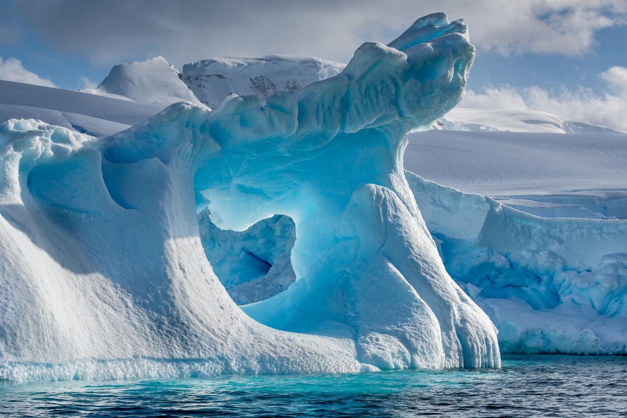 eroded iceberg floating in Wilhemina Bay Antarctica