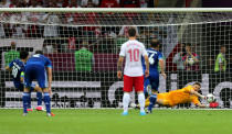 WARSAW, POLAND - JUNE 08: Przemyslaw Tyton of Poland saves Giorgos Karagounis of Greece's penalty during the UEFA EURO 2012 group A match between Poland and Greece at The National Stadium on June 8, 2012 in Warsaw, Poland. (Photo by Alex Grimm/Getty Images)