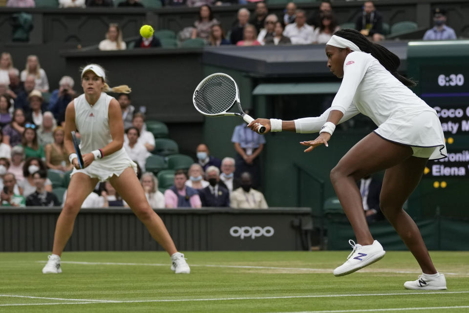 Coco Gauff of the U.S. plays during the women's doubles third round match against Russia's Veronika Kudermetova and Elena Vesnina on day eight of the Wimbledon Tennis Championships in London, Tuesday, July 6, 2021. (AP Photo/Kirsty Wigglesworth)