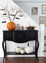 <p>Perk up the foyer with a bevy of fluttering bats. Simply stick backyard branches into a plain pumpkin and hang a few spooky ornaments. </p><p><em><a href="https://www.goodhousekeeping.com/holidays/halloween-ideas/g421/halloween-decorating-ideas-1007/" rel="nofollow noopener" target="_blank" data-ylk="slk:Get the tutorial »;elm:context_link;itc:0;sec:content-canvas" class="link ">Get the tutorial »</a></em></p>