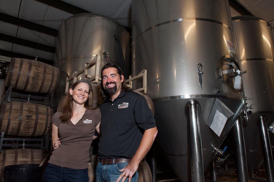 Lazy Magnolia Brewing cofounders Leslie and Mark Henderson, shown in 2013, sold their first beer in March 2005. Now they have sold their brewery to Utah investors.