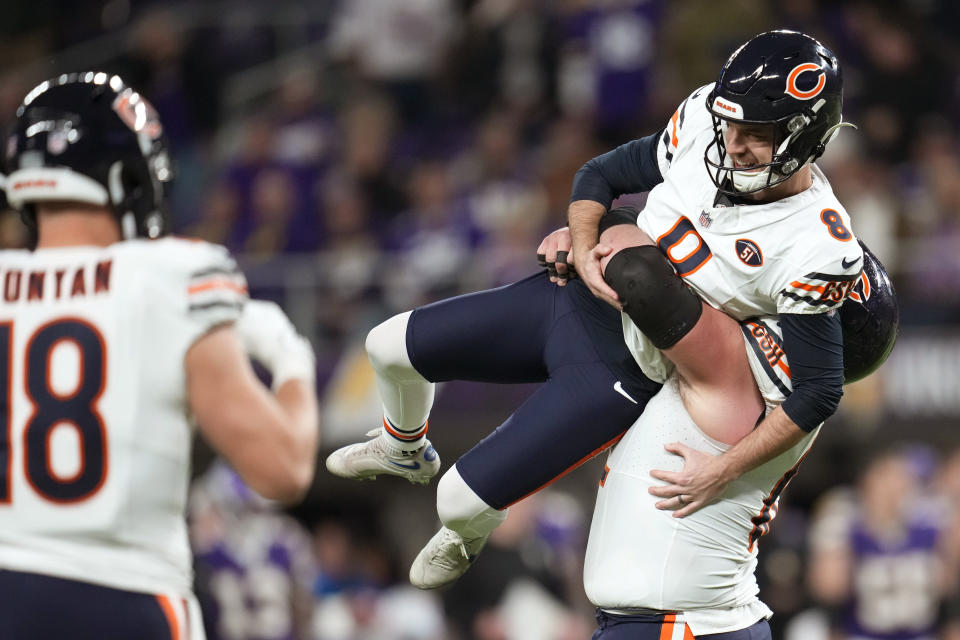 Chicago Bears place-kicker Cairo Santos (8) celebrates with teammates after kicking a 30-yard field goal during the second half of an NFL football game against the Minnesota Vikings, Monday, Nov. 27, 2023, in Minneapolis. The Bears won 12-10. (AP Photo/Abbie Parr)