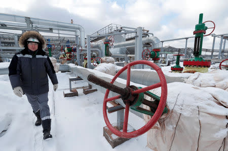 An employee walks at an oil treatment plant in the Yarakta Oil Field, owned by Irkutsk Oil Company (INK), in Irkutsk Region, Russia March 10, 2019. REUTERS/Vasily Fedosenko