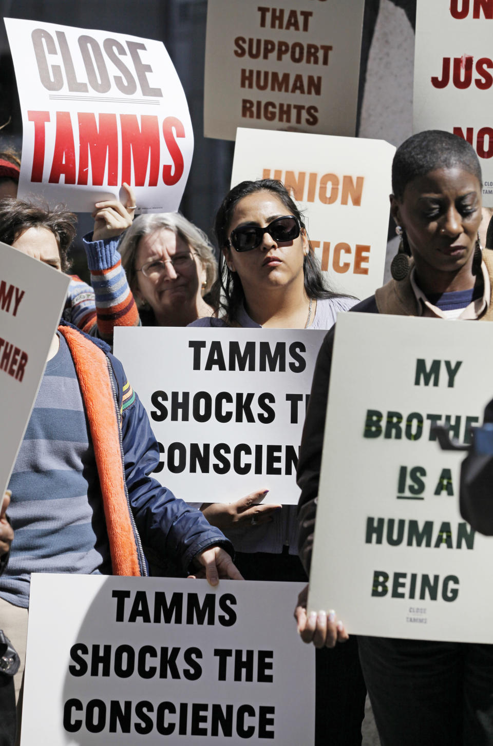 Mothers of prisoners at Tamms Correctional Center in Tamms, Ill., march through downtown Chicago, Wednesday, April 4, 2012, to show their support of Gov. Pat Quinn's proposal to close the southern Illinois prison. They took aim at a union opposed to the prison's closure because it would mean layoffs for guards and other personnel. The mothers say the issue is about "human dignity, not jobs." Quinn's budget would close 14 state facilities, including Tamms, to save money. (AP Photo/Kiichiro Sato)