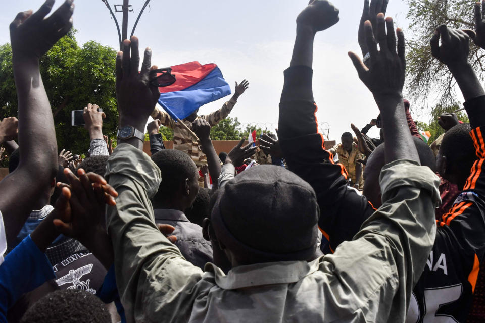 Protesters cheer Nigerien troops as they gather in front of the French Embassy in Niamey during a demonstration that followed a rally in support of Niger's junta on July 30, 2023. (AFP - Getty Images)
