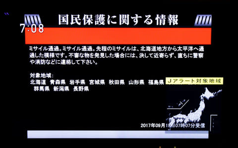 Kim Jong-un goads the world with another missile over Japan Guam in range of North Korea's longest-ever ballistic test flight South responds with simulated strike on North moments later US urges China and Russia to 'take direct actions of their own' China says it "opposes" the test North Korean official says Pyongyang will defy sanctions for a "thousand years" Anger and fear in Japan as millions woken by sirens and alerts Analysis: Missile a message to US - 'we can strike Guam at any time' How war with North Korea could start and what it would look like What is North Korea's missile range? Everything you need to know North Korea has fired an intermediate-range ballistic missile that flew over Japan before landing in the northern Pacific Ocean. It was the second aggressive test-flight over the territory of the close US ally in less than a month and it followed the sixth and most powerful nuclear test by North Korea to date on September 3. South Korea's Joint Chiefs of Staff said the missile travelled about 3,700 kilometers (2,300 miles) while reaching a maximum height of 770 kilometers (478 miles). Unnerving alert sirens ring out in Japan in response to North Korea's missile launch 00:36 The missile, launched from Sunan, the site of Pyongyang's international airport, flew farther than any other missile North Korea has fired. The distance it flew is slightly greater than between the North Korean capital and the American air base in Guam. It was "the furthest overground any of their ballistic missiles has ever travelled", Joseph Dempsey of the International Institute for Strategic Studies said on Twitter. This is the intermediate-range strategic ballistic rocket Hwasong-12 l that was launched on August 29 by North Korea Credit: AFP Physicist David Wright, of the Union of Concerned Scientists, added: "North Korea demonstrated that it could reach Guam with this missile, although the payload the missile was carrying is not known" and its accuracy was in doubt. Sirens sounded and alerts were issued in Japan as residents were warned to take shelter while the missile passed over Hoakkaido. "We can never tolerate that North Korea trampled on the international community's strong, united resolve toward peace that has been shown in UN resolutions and went ahead again with this outrageous act," Shinzo Abe, the Japanese prime minister, said. Map: Guam in relation to North Korea Jim Mattis, US Defence Secretary, called the latest missile launch a reckless act and "put millions of Japanese in duck and cover". US Secretary of State Rex Tillerson urged China and Russia to do more to rein in North Korea. "China and Russia must indicate their intolerance for these reckless missile launches by taking direct actions of their own," Mr Tillerson said in a statement. South Korea stages missile drill in response to latest North Korean launch 00:56 China said it "opposes" the test, but reiterated its call that "all parties" should exercise restraint. "The situation on the Korean Peninsula is complicated and sensitive,” a spokeswoman said. In response to the launch, South Korea's military immediately carried out a ballistic missile drill of its own, the defence ministry said, adding it took place while the North's rocket was still airborne. A South Korean Hyunmoo-II missile is fired toward the East Sea in response to the latest North Korean missile test Credit: EPA One Hyunmu missile travelled 250 kilometres into the East Sea, Korea's name for the Sea of Japan - a trajectory intentionally chosen to represent the distance to the launch site at Sunan, near Pyongyang's airport, it added. But embarrassingly, another failed soon after being fired. President Moon Jae-In told an emergency meeting of Seoul's national security council that dialogue with the North was "impossible in a situation like this", adding that the South had the power to destroy it. In New York, the Security Council called an emergency meeting for later on Friday. However, a North Korean official said Pyongyang would continue to defy sanctions. Choe Kang-il, deputy director general for North American affairs at the North's foreign ministry, said: “You can impose whatever sanctions you want, but no matter how long these sanctions last - whether it is for 100 or 1,000 years - we will keep stepping up efforts and continue with our planned tests.” North Korea last month used the airport to fire a Hwasong-12 intermediate range missile that flew over northern Japan. Pedestrians walk under a large-scale monitor displaying the flying course of a North Korean ballistic missile flying over Japan Credit: EPA The North then declared it a "meaningful prelude" to containing the U.S. Pacific island territory of Guam and the start of more ballistic missile launches toward the Pacific Ocean. Japan's Chief Cabinet Secretary Yoshihide Suga denounced North Korea's latest launch, saying he was conveying "strong anger" on behalf of the Japanese people. Mr Suga said Japan "will not tolerate the repeated and excessive provocations." North Korea nuclear grid 9:19AM China "opposes" North Korea's missile test China said it opposed North Korea’s latest missile test and warned that the situation on the Korean peninsula was “complicated and sensitive”, China Correspondent Neil Connor reports from Beijing. Foreign ministry spokeswoman Hua Chunying said: “China opposes North Korea violating relevant UN Security Council resolutions by making use of ballistic missile technology to embark on launch activities. “Currently, the situation on the Korean Peninsula is complicated and sensitive,” Ms Hua told a regular briefing in Beijing. “All relevant parties should exercise restraint and should not make any moves which would escalate tensions.” 8:25AM Boris Johnson urged united response to North Korea's latest missile test The latest missile launch by North Korea must be met with a united international response, Foreign Secretary Boris Johnson has urged. Mr Johnson condemned the test as "illegal" and the latest sign of "provocation" from Pyongyang. "Yet another illegal missile launch by North Korea. UK and international community will stand together in the face of these provocations," he said on Twitter. In a subsequent statement, he added: "The UK and the international community have condemned the aggressive and illegal actions of the North Korean regime, and the succession of missile and nuclear tests. We stand firmly by Japan and our other international partners. "We are working to mobilise world opinion with the aim of achieving a diplomatic solution to the situation on the Korean peninsula. "This week the most stringent UN sanctions regime placed on any nation in the 21st century was imposed on North Korea, after being unanimously agreed at the UN Security Council. "These measures now need to be robustly enforced. We urge all states to play their part in changing the course North Korea is taking." Yet another illegal missile launch by North Korea. UK and international community will stand together in the face of these provocations.— Boris Johnson (@BorisJohnson) September 15, 2017 Before the latest launch, Mr Johnson had called for China to use its influence over North Korea to ease tensions caused by Pyongyang's nuclear and missile development programmes. At a press conference with US counterpart Rex Tillerson on Thursday, Mr Johnson said Pyongyang had "defied the world". 7:56AM What kinds of missile was launched by North Korea? The missile was launched from Sunan, the location of Pyongyang's international airport and the origin of the earlier missile that flew over Japan. Analysts have speculated the new test was of the same intermediate-range missile launched in that earlier flight, the Hwasong-12, and was meant to show Washington that the North can hit Guam if it chose to do so. This graphic explains what we know about North Korea's missiles: North Korea's missile test range 7:51AM North Korea 'has Guam in mind', says Japan Japan's defence minister said on Friday that he believed North Korea "has Guam in mind" after its most recent missile launch, noting it had sufficient range to hit the US territory. Pyongyang has threatened to hit the US Pacific territory with "enveloping fire," sparking dire warnings from US President Donald Trump. Itsunori Onodera told reporters that the latest missile, which overflew Japanese territory, flew 2,300 miles - "long enough to cover Guam", which is 2,100 miles from North Korea. "We cannot assume North Korea's intention, but given what it has said, I think it has Guam in mind," Onodera said. He warned that "similar actions (by the North) would continue" as Pyongyang appeared to have shrugged off UN sanctions agreed earlier this week. The US Pacific Command confirmed the launch was an intermediate range ballistic missile (IRBM) but said it posed no threat to Guam or to the American mainland. But, for the second time in less than a month, it overflew Japan's northernmost island of Hokkaido, sparking loudspeaker alerts and warnings to citizens to take cover. At a glance | Guam 7:22AM How much of a threat to the UK is North Korea? As North Korea continues to goad the world with its weapons programme, we examine in this video how much of a threat Kim Jong-un's regime is to Britain. Reality check: Is North Korea a threat to the UK? 01:48 6:07AM 'This latest test is proof" North Korea's launch of a ballistic missile that flew more than 2,300 miles before falling into the Pacific Ocean is a "clear and unequivocal" message to the United States that Pyongyang has the ability to strike Guam. The distance from Pyongyang to Guam is a little over 2,100 miles and North Korea identified it as a target in early August, threatening to launch four Hwasong-12 intermediate-range ballistic missiles into waters close to the island. North Korea has threatened to attack the US base in Guam Credit: Reuters The intention, according to analysts, was to demonstrate that Pyongyang would have no compunction in the event of war from targeting the resort island in order to interrupt air attacks on the North as well as efforts to reinforce ground forces on the Korean Peninsula. "From previous launches and the altitude and ranges of those missiles, it has been assumed that Guam is within range of the North's missiles, but this latest test is proof", Garren Mulloy, a defence expert and associate professor of international relations at Japan's Daito Bunka University, told The Telegraph. Read the full analysis here. 5:28AM South Korean missile test fails South Korean President Moon Jae-in ordered his military to conduct a live-fire ballistic missile drill in response to the North Korean launch. South Korea's Joint Chiefs of Staff said one of the two missiles fired in the drill hit a sea target about 250 kilometers (155 miles) away, which was approximately the distance to Pyongyang's Sunan, but the other failed in flight shortly after launch. 4:57AM 'This rocket has meaning' North Korea has launched dozens of missiles under young leader Kim Jong -un as it accelerates a weapons programme designed to give it the ability to target the United States with a powerful, nuclear-tipped missile. Two tests in July were for long-range intercontinental ballistic missiles capable of reaching at least parts of the US mainland. Yang Uk, a senior research fellow at the Korea Defence and Security Forum said: "This rocket has meaning in that North Korea is pushing towards technological completion of its missiles and that North Korea may be feeling some pressure that they need to show the international community something." North Korean missile ranges 4:32AM "North Korea is a terrorist nation Some residents in Japan have reacted angrily to the latest test. "Japanese people have not been subjected to this kind of threat since the end of the war more than 70 years ago", Ken Kato, a Tokyo-based human rights activist, told the Telegraph. "People genuinely feel that unless something is done quite soon, then their families are at risk", he told The Telegraph. "This is the situation we are in now and we have to adapt to these realities, but these missile launches and nuclear tests are leading a lot of people to conclude that Japan needs its own nuclear deterrent. A passerby walks under a TV screen reporting news about North Korea's missile launch in Tokyo Credit: Reuters "Personally, the launch did not come as much of a surprise because this is becoming a fact of life for us in Japan", he said. "But there is also a growing sense of anger among ordinary people. "North Korea is a terrorist nation and I expect this situation to escalate even further," Read the full story here. 3:36AM 'It's pretty scary' Residents in northern Japan appeared calm and went about their business as normal despite the sirens warning them of a missile flying overhead. J-Alert going out on a civil defense box in someone's house pic.twitter.com/FZ8jEKJGEO— Strategic Sentinel (@StratSentinel) September 14, 2017 It was the second such alert in a matter of weeks, but, for some residents, there was no question of this becoming a routine event. Yoshihiro Saito, who works in the small fishing town of Erimo on Hokkaido, told AFP: "I cannot say that we are used to this. I mean, the missile flew right above our town. It's not a very comforting thing to hear. "It's pretty scary. I heard that it went 2,000 kilometres in the Pacific and dropped in the sea" where 16 of his ships were operating under the missile's flight path." 3:27AM US 'decided not to hit missile on launch pad' The New York Times reports that the Trump administration chose not to take out the missile on the launching pad, even though they saw it being fueled up a day ago. Officials said Vice President Mike Pence was even shown images of the missile during a visit to one of the nation’s intelligence agencies. A North Korean Hwasong 12missile is paraded across Kim Il Sung Square during a military parade in Pyongyang Credit: AP 3:21AM North Korean passenger flight arrives in Beijing Air Koryo flight 151, which left the area of the missile launch 90 minutes after it was conducted, has now landed in Beijing - 10 minutes ahead of schedule. Read the full story here. 3:17AM South Korean leader warns of new threats South Korean President Moon Jae-in says North Korea's latest launch of a missile over Japan will only result in further diplomatic and economic isolation for the North. "President Moon ordered officials to closely analyse and prepare for new possible North Korean threats like EMP (electro-magnetic pulse) and biochemical attacks," Moon's spokesman Park Su-hyun told a briefing. North Korea said earlier this month it was developing a hydrogen bomb that can carry out an EMP attack. Experts disagree on whether the North would have the capability to mount such an attack, which would involve setting off a bomb in the atmosphere that could cause major damage to power grids and other infrastructure. 2:35AM Business as usual at airport The missile was launched at 6.59am from Sunan, the site of Pyongyang's international airport. An hour and a half later a passenger flight took off for Beijing. Air Koryo flight from missile launch site @ Pyongyang Sunan Airport is going to arrive at Beijing in about one hour from now pic.twitter.com/KtyAYiOjSx— Chad O'Carroll (@chadocl) September 15, 2017 1:45AM Tillerson: China not doing enough Statement from #SecState#Tillerson on #DPRK launch. Says #China is not doing enough. pic.twitter.com/4k67U6sJ6S— Strategic Sentinel (@StratSentinel) September 15, 2017 1:44AM Abe: North Korea's actions can't be tolerated Japanese Prime Minister Shinzo Abe says United Nations sanctions on North Korea needed to be firmly imposed. Abe said that the international community must send a clear message to North Korea over its provocative actions. "We can never tolerate that North Korea trampled on the international community's strong, united resolve toward peace that has been shown in UN resolutions and went ahead again with this outrageous act." 1:27AM 'Steady as she goes' US Defence Secretary Jim Mattis says North Korea's missile launch over Japan "put millions of Japanese into duck and cover" before it landed in the Pacific Ocean, and added that top US officials had fully coordinated after the test-launch. "We have just got done with the calls we always make to coordinate among ourselves. Steady as she goes," Mattis told reporters traveling with him during a visit to the U.S. Strategic Command, which oversees U.S. nuclear forces. Video of sirens sounding in Niigata, Japan warning citizens of the incoming #DPRK missile from @joshdcaplanpic.twitter.com/yH6jHXGWy1— Strategic Sentinel (@StratSentinel) September 14, 2017 1:16AM UN Security Council to meet on Friday The United Nations Security Council will meet at 3 p.m. EDT (1900 GMT) on Friday on the latest North Korea missile test, diplomats said, at the request of the United States and Japan. The 15-member Security Council unanimously stepped up sanctions against North Korea on Monday over its Sept. 3 nuclear test, imposing a ban on the country's textile exports and capping imports of crude oil. It was the ninth U.N. sanctions resolution adopted on North Korea since 2006. 1:04AM Pressure on China In confronting North Korea’s latest provocation, the focus will almost certainly shift once again to Beijing, China Correspondent Neil Connor says. Donald Trump has warned that the United States would cease trading with any country that trades with North Korea – comments which were met with concern in China. And in London only hours before Pyongyang fired its latest projectile, the US secretary of state Rex Tillerson urged China to use its supply of oil to North Korea as leverage against the regime. "That is a very powerful tool and it has been used in the past," Tillerson said at a news conference. "We hope China will not reject that." In 2003, China shut down its oil pipeline to North Korea for three days after a missile launch. Officials said it was due to a mechanical failure, although it was thought to be deliberate and ultimately helped force a climb-down from Pyongyang. 12:51AM US believe it was an intermediate range ballistic missile The US Pacific Command says initial assessment indicates the projectile was an intermediate range ballistic missile. It said the North American Aerospace Defence Command (NORAD) determined this ballistic missile did not pose a threat to North America, nor Guam. "Our commitment to the defence of our allies, including the Republic of Korea and Japan, in the face of these threats, remains ironclad. We remain prepared to defend ourselves and our allies from any attack or provocation. 12:44AM North Korea tries to win more military space South Korean experts said the August launch was Pyongyang's attempt to make missiles flying over Japan an accepted norm as it seeks to test new projectiles and win more military space in the region dominated by its enemies. The Offices of Guam Homeland Security and Civil Defence said the latest launch posed no immediate threat to Guam or the Marinas. Here is a map which shows #Guam well within and even exceeding the range of today's test from one of our analysts @Kapitol23pic.twitter.com/V7i6wOuwsP— Strategic Sentinel (@StratSentinel) September 14, 2017 12:42AM Trump briefed on launch White House spokeswoman Sarah Huckabee Sanders says US President Donald Trump has been briefed on North Korea's launch of the unidentified missile over Japan. "The President has been briefed on the latest North Korea missile launch by General Kelly," Sanders said, referring to the president's chief of staff. 12:40AM South Korea conducts drill in response South Korea's Defence Ministry said the country's military conducted a live-fire drill of a Hyunmoo-2 ballistic missile in response to the North's launch on Friday. It came two days after it said it conducted its first live-fire drill for an advanced air-launched cruise missile it says will strengthen its pre-emptive strike capability against North Korea in the event of crisis. Watch as South Korea's new Taurus cruise missile hits target 00:45 12:27AM Australia condemns launch Australia, a strong and vocal ally of the United States, quickly condemned the launch. In an interview with Sky News, Prime Minister Malcolm Turnbull said: "This is another dangerous, reckless, criminal act by the North Korean regime, threatening the stability of the region and the world and we condemn it, utterly. "This is a sign, I believe, of their frustration at the increased sanctions on North Korea, recently imposed by the Security Council. It's a sign that the sanctions are working." 12:24AM Map of splash down This is where the North Korean missile landed, 2,000km/1,200 miles east of Hokkaido (map from NHK) pic.twitter.com/OMn0JD8W1I— Anna Fifield (@annafifield) September 14, 2017 12:18AM Ready for take-off? LATEST: NK missile was launched from Pyongyang airport. Passengers will be boarding JS151 now at Sunan awaiting take-off, theoretically pic.twitter.com/TrnZ58vblg— Chad O'Carroll (@chadocl) September 14, 2017 12:15AM US assumes nuclear test was H bomb The missile test has come shortly after the top commander of U.S. nuclear forces said he assumed the Sept. 3 nuclear test by North Korea was a hydrogen bomb, suggesting a heightened US concern that the North has advanced to a new level of nuclear firepower. Air Force Gen. John E. Hyten, commander of Strategic Command, told reporters that while he was not in a position to confirm it, he assumes from the size of the underground explosion and other factors that it was a hydrogen bomb - which is a leap beyond the fission, or atomic, bombs North Korea has previously tested. This before-and-after images courtesy of Planet, show a closer view of the Punggye-ri test site Credit: AFP North Korea claimed they exploded a hydrogen bomb, and while U.S. officials have not contradicted them, they have not confirmed it, either. "When I look at a thing that size, I as a military officer assume that it's a hydrogen bomb," Hyten said. As head of Strategic Command, he would be in charge of all elements of the U.S. nuclear force in the event of nuclear war. "I have to (assume this)," he added, "I have to make that assumption. What I saw equates to a hydrogen bomb. I saw the event. I saw the indications that came from that event. I saw the size, I saw the reports, and therefore to me I'm assuming it was a hydrogen bomb." 12:08AM Missile 'flew furthest yet' Seoul's defence ministry said it probably travelled around 3,700 kilometres and reached a maximum altitude of 770 kilometres - both higher and further than the previous device. An important superlative here: this is North Korea's longest-range demonstrated flight of a ballistic missile ever. https://t.co/hqV0qltcHM— Ankit Panda (@nktpnd) September 14, 2017 However, the intercontinental ballistic missile had the potential to fly further. 12:02AM Is North Korea planning anther nuclear test? Details of the latest launch came within hours of reports suggesting that the North Koreans were preparing to carry out another underground atomic test. Satellite images showed mining equipment and trucks close to the Punggye-ri Nuclear Test Site. Further activity was also seen close to another underground access point. The main concern had been whether the North Koreans have succeeded in developing a bomb small enough to fit onto an intercontinental ballistic missile. 11:56PM Japan strongly protests missile launch Japan's Chief Cabinet Secretary Yoshihide Suga says Japan is strongly protesting what it called Pyongyang's latest intolerable provocation. The missile was launched at 6:57 a.m. Japan time (2157 GMT), flew over Hokkaido and splashed down at 7:06 a.m. (2206 GMT) some 2,000 kilometres east of the northern island's Cape Erimo, he said. Japan protests the latest launch in the strongest terms and will take appropriate and timely action at the United Nations and elsewhere, staying in close contact with the United States and South Korea, Suga told reporters. The Japanese government's alert message called J-alert notifying citizens of a ballistic missile launch by North Korea is seen on a television screen in Tokyo Credit: Reuters 11:50PM The alert received by Japanese residents #northkorea launched another #missile. Hearing the sirens out here in #niigata#japan. Thanks for the heads up, J-alert pic.twitter.com/Yd459DPfw8— Michael Bosack (@MikeBosack) September 14, 2017 11:40PM Missile suspected to be same as last test It still could be an ICBM, but it's more likely that it's the Hwasong-12 IRBM—the same thing they tested on August 29.— Ankit Panda (@nktpnd) September 14, 2017 You can read more about that missile here. Previous launches have ended in catastrophic failure., so to launch from the capital was quite a risk. 11:37PM Details of flight NHK reports that North Korea launched the missile at 6.57am local time and it flew over Hokkaido towards the Pacific at 7.06am. It splashed down in the Pacific at 7.16am. 11:34PM Japanese residents warned not to approach parts of missile NHK warning that if you find parts of missile that dropped as it flew over do not approach pic.twitter.com/iFHnkYMTNI— Joseph Tame (@tamegoeswild) September 14, 2017 11:33PM South Korea convenes emergency meeting South Korea's presidential Blue House has called an urgent National Security Council meeting. The North's launch comes a day after the North threatened to sink Japan and reduce the United States to "ashes and darkness" for supporting a U.N. Security Council resolution imposing new sanctions against it for its Sept. 3 nuclear test. The North previously launched a ballistic missile from Sunan on Aug. 29 which flew over Japan's Hokkaido island and landed in the Pacific waters. 11:26PM Japanese residents wanrned to take shelter NHK telling people to take shelter in buildings, or underground, stay away from windows #missile#northkorea#japanpic.twitter.com/HE389O1mnw— Joseph Tame (@tamegoeswild) September 14, 2017 North Korea's nuclear history: key moments