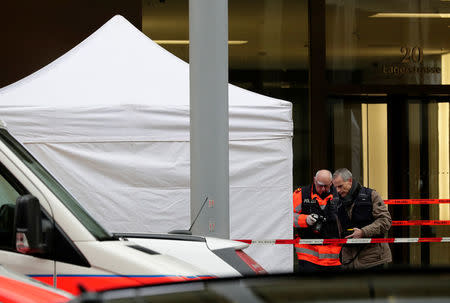 Police investigate a crime scene after two people, police said, were killed in Zurich, Switzerland, February 23, 2018. REUTERS/Moritz Hager