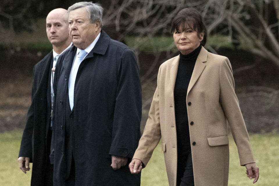 FILE - First lady Melania Trump's parents Viktor Knavs, second from left, and Amalija Knavs walk on the South Lawn of White House, Jan. 31, 2020, in Washington. Amalija Knavs has died, according to an announcement by Trump late Tuesday, Jan. 9, 2024. (AP Photo/Alex Brandon)