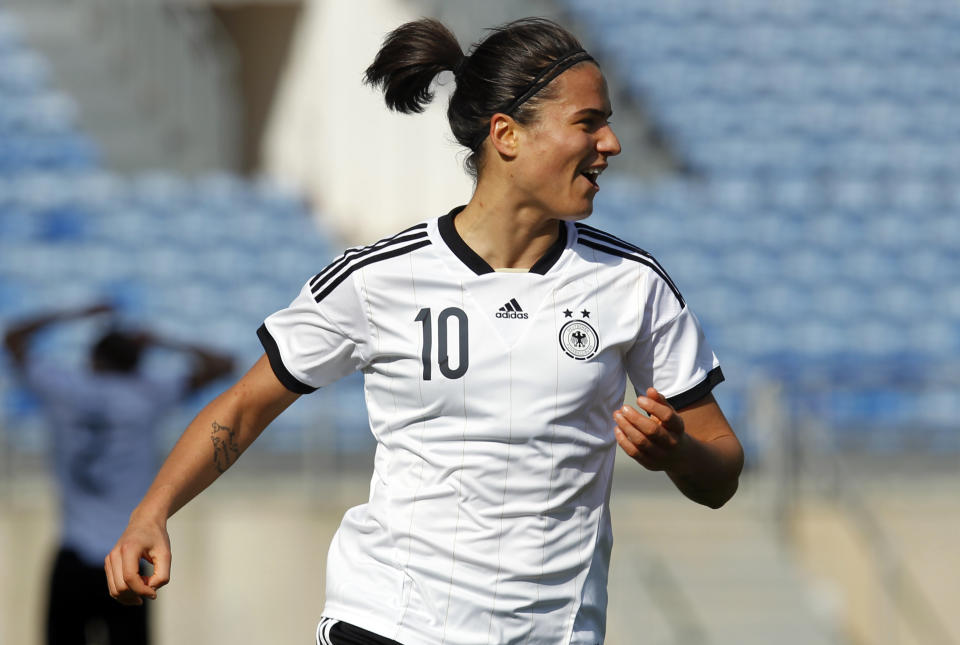 Germany's Dzsenifer Marozsan celebrates after scoring her side's third goal during the women's soccer Algarve Cup final match between Germany and Japan at the Algarve stadium, outside Faro, southern Portugal, Wednesday, March 12, 2014. (AP Photo/Francisco Seco)