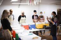 Jing Xeu teaches a pottery class inside Token Studio, the business she owns, amid the coronavirus disease (COVID-19) outbreak, in London