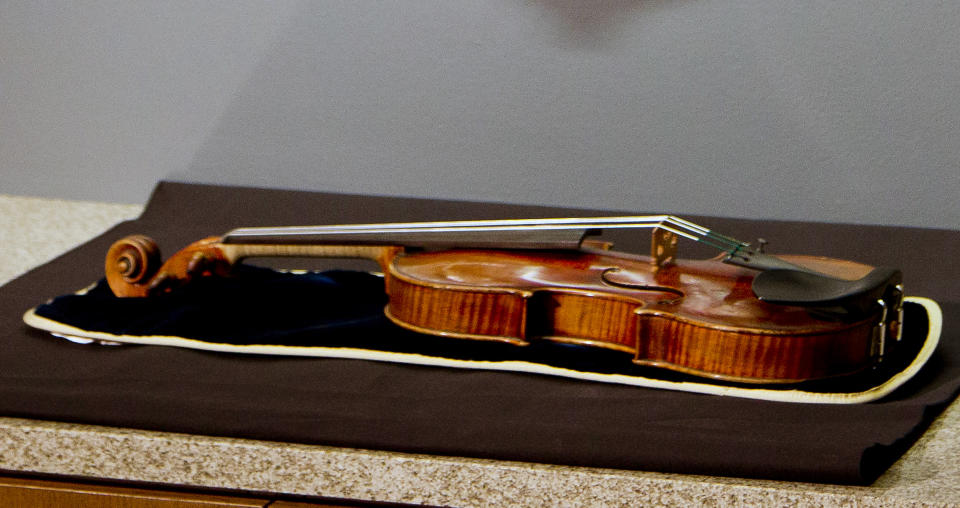 The 300-year-old Stradivarius violin that was taken from the Milwaukee Symphony Orchestra's concertmaster in an armed robbery is on display for the media after it was recently recovered, in Milwaukee, Wisconsin February 6, 2014. The Stradivarius violin worth millions of dollars, which was stolen from a concert violinist in an armed robbery last week, has been recovered from a suitcase in the attic of a Milwaukee house, law enforcement officials said on Thursday. REUTERS/Darren Hauck (UNITED STATES - Tags: CRIME LAW ENTERTAINMENT SOCIETY)