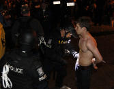 Lexington Police arrest a University of Kentucky student on the streets after University of Connecticut defeated Kentucky in the NCAA Men's National Basketball Championship near the university campus in Lexington, Kentucky, April 7, 2014. REUTERS/ John Sommers II (UNITED STATES - Tags: CIVIL UNREST SPORT BASKETBALL)