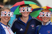 LONDON, ENGLAND - JULY 29: Members of the wear 2012 glasses at Olympic Park on Day 2 of the London 2012 Olympic Games on July 29, 2012 in London, England. (Photo by Jeff J Mitchell/Getty Images)