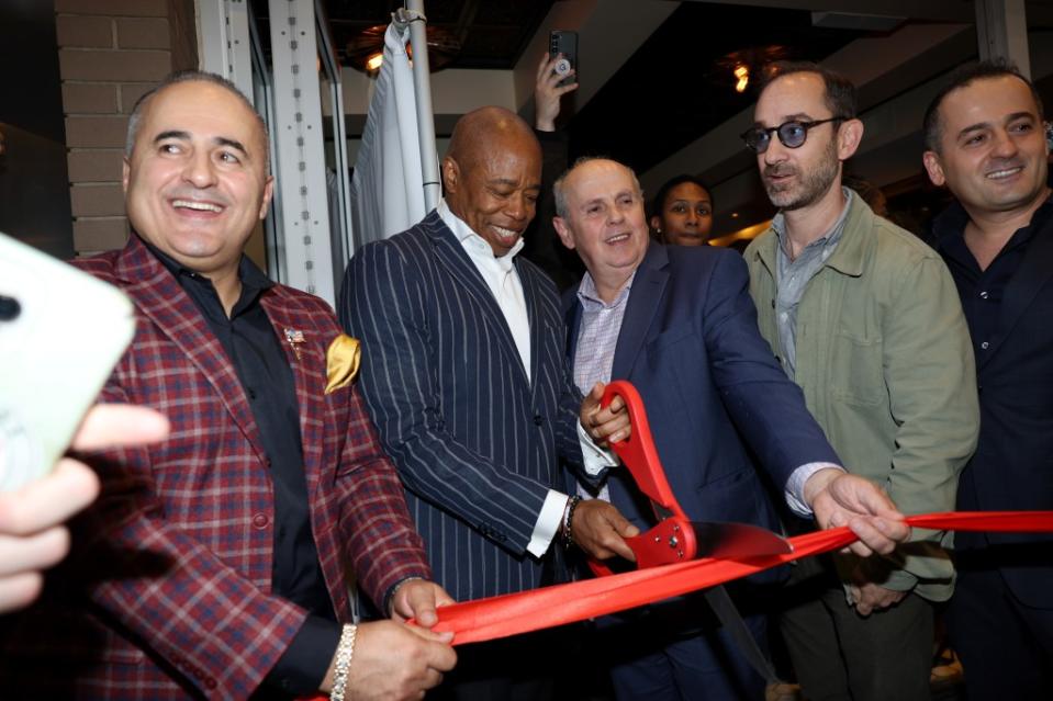 Jack Sinanaj, Mayor Eric Adams, Russ Sinanaj, Andrew Rigie, and Jeff Sinanaj at the grand opening of Empire Steak House on October 25, 2023 in New York City. WireImage