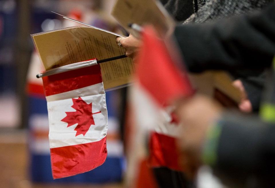  New Canadians are sworn in in Edmonton. Lifting the cap on how many hours international students can work may encourage more of them to remain in Canada permanently, officials say.