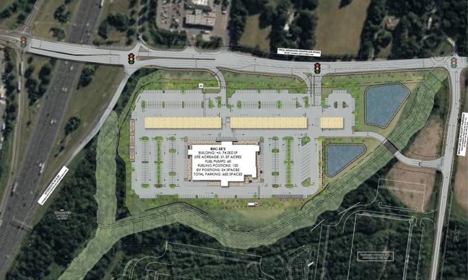 The site plan for a 74,000-square-foot Buc-ee’s travel plaza on Trollingwood-Hawfields Road in Mebane shows three driveways and major road upgrades, including the addition of four traffic lights.