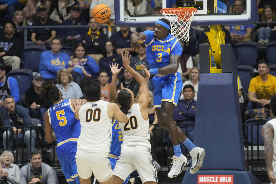 UCLA forward Adem Bona (3) blocks a shot attempt by California guard Jaylon Tyson (20) during the second half of an NCAA college basketball game in Berkeley, Calif., Saturday, Feb. 10, 2024. (AP Photo/Jeff Chiu)