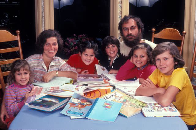 <p>Dianna Whitley/Getty</p> Summer Phoenix (left), Arlyn Phoenix, Rain Phoenix, Joaquin Phoenix, John Lee Phoenix, Liberty Phoenix and River Phoenix photographed in Los Angeles, 1983