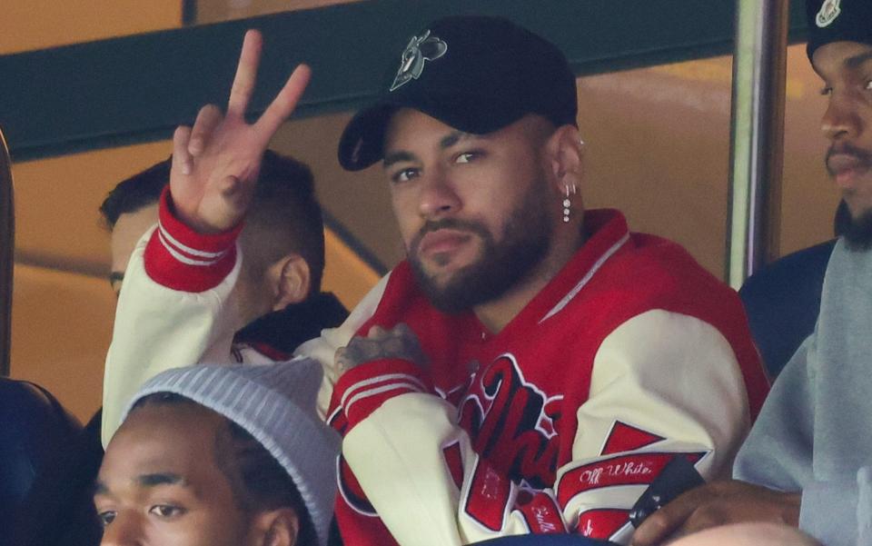 Neymar watches the Ligue 1 match between Paris St-Germain and Lorient - WireImage/Pierre Suu