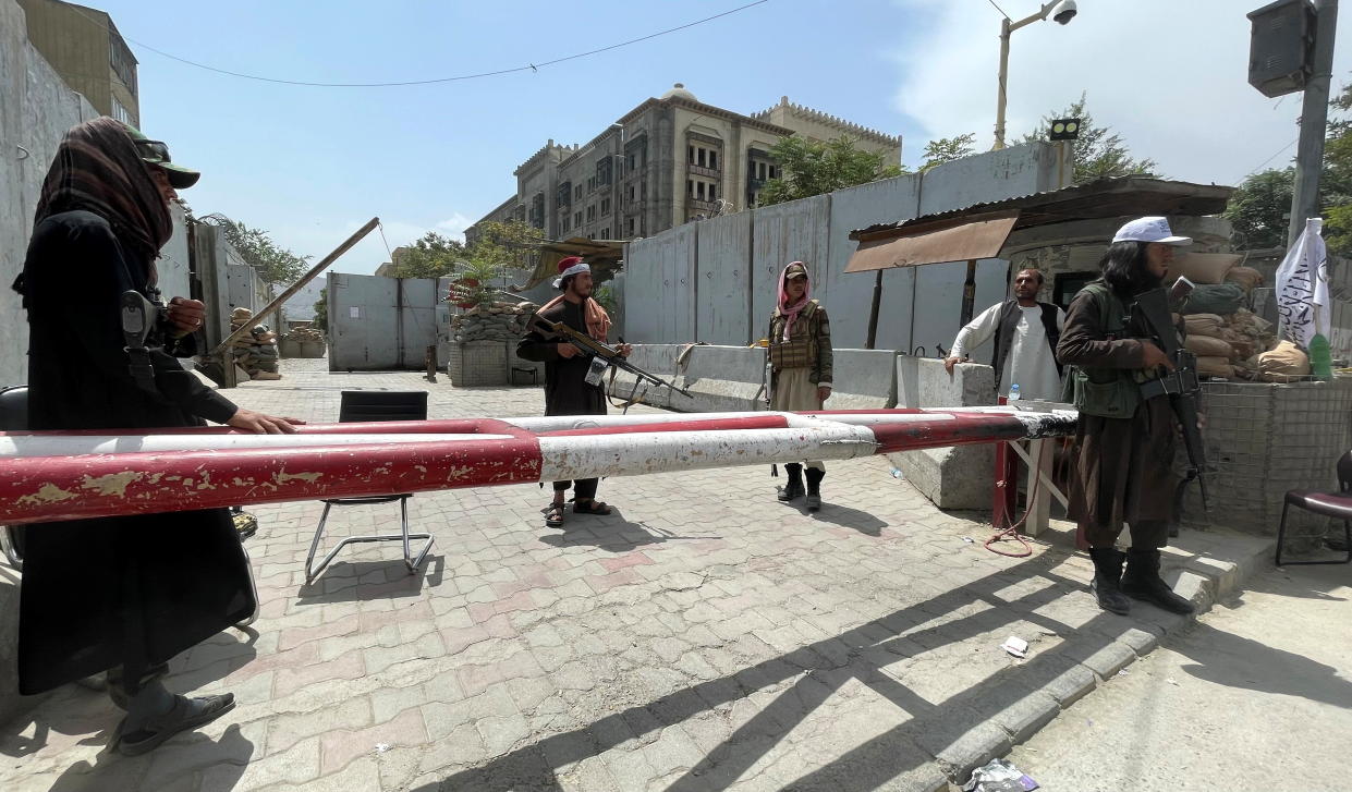 Members of Taliban forces keep watch at a checkpoint in Kabul on Tuesday. 