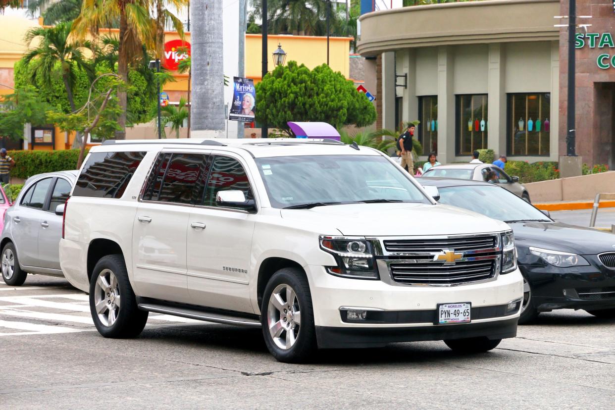 Acapulco, Mexico - May 30, 2017: White motor car Chevrolet Suburban in the city street.