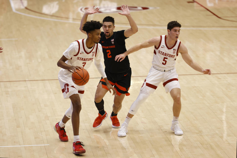 Stanford forward Ziaire Williams (3) brings the ball up against Oregon State guard Jarod Lucas (2) during the first half of an NCAA college basketball game in Stanford, Calif., Saturday, Feb. 27, 2021. (AP Photo/Josie Lepe)