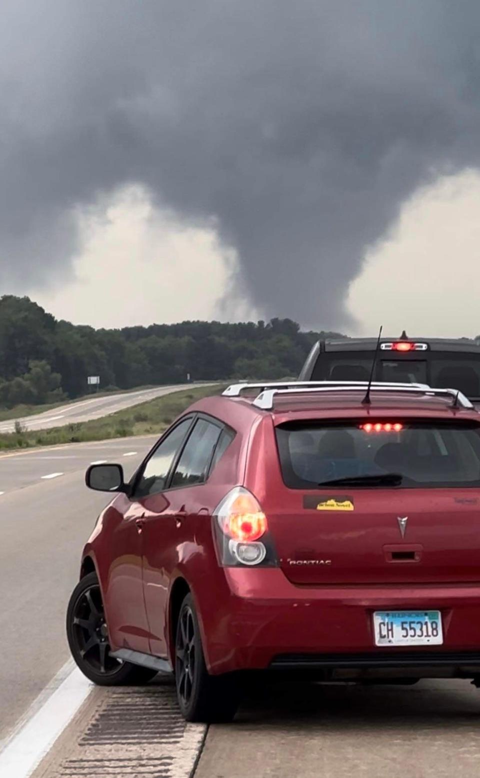 An apparent tornado that was reported near Perry on Friday Aug. 11, 2023, is seen in this photo take by Owosso resident Bill Bouwman while driving home from Lansing on Interstate 69.