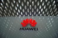 FILE PHOTO: A Huawei company logo is seen at the Shenzhen International Airport in Shenzhen