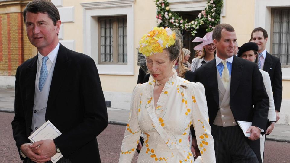 The Princess Royal in a white wedding guest dress with her husband Timothy Laurence