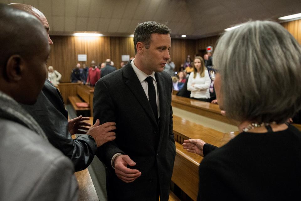 Olympic athlete Oscar Pistorius speaks with relatives after sentencing at the High Court on 6 July 2016 at the High Court in Pretoria, South Africa (Getty Images)