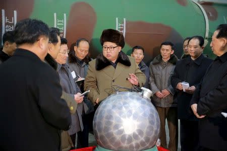 FILE PHOTO: North Korean leader Kim Jong Un meets scientists and technicians in the field of researches into nuclear weapons in this undated photo released by North Korea's Korean Central News Agency (KCNA) in Pyongyang March 9, 2016. REUTERS/KCNA/File Photo