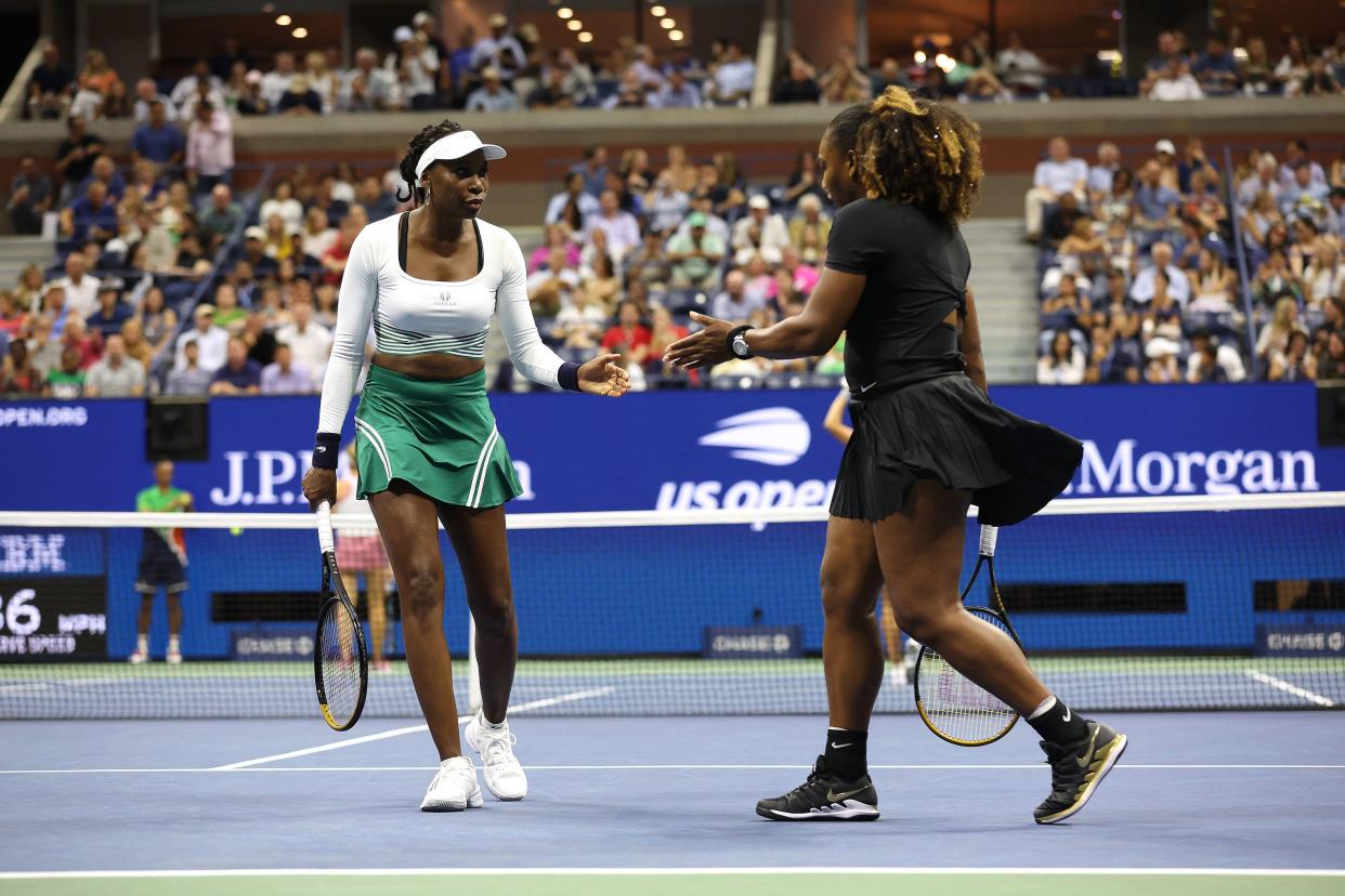 Serena Williams and Venus Williams of the United States react to a point against Lucie Hradecka and Linda Noskova of Czech Republic during the Women's Doubles First Round match on Day Four of the 2022 U.S. Open at USTA Billie Jean King National Tennis Center on Sept. 1, 2022, in the Flushing neighborhood of the Queens borough of New York City.