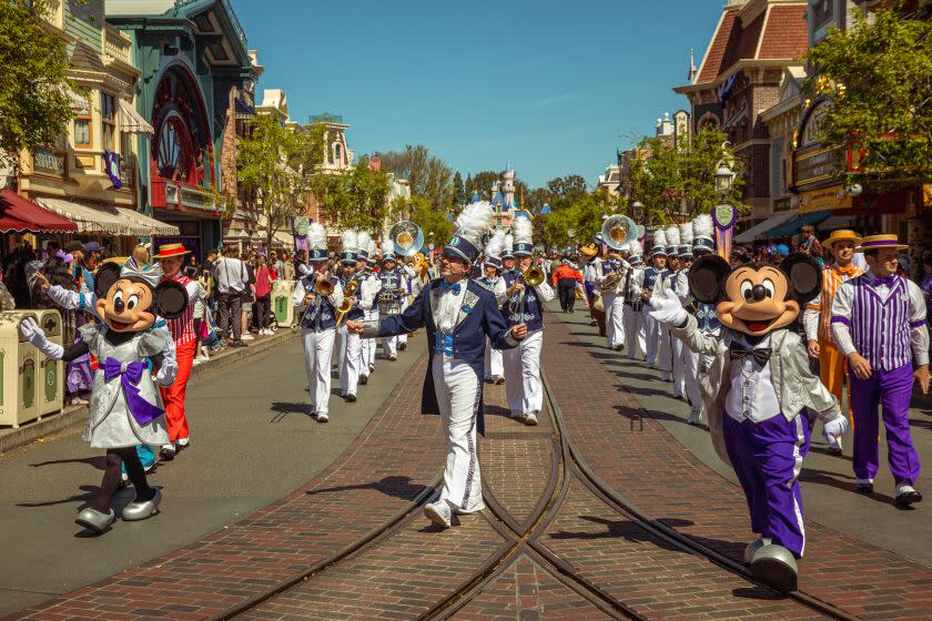 ANAHEIM, CA - MARCH 18: Disney marching band on Main Street in Disneyland on Saturday, March 18, 2023 in Anaheim, CA. (Irfan Khan / Los Angeles Times)