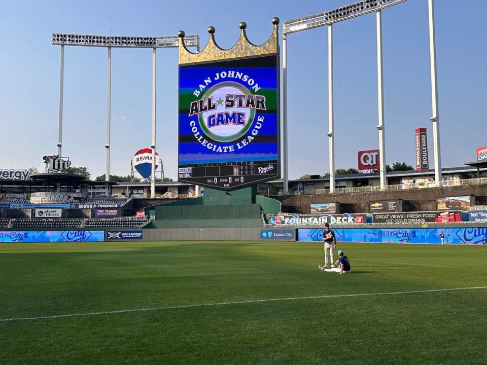 Two All-Stars from the Ban Johnson Collegiate League sit on the field at Kauffman Stadium prior to first pitch on Wednesday, July 10, 2024.