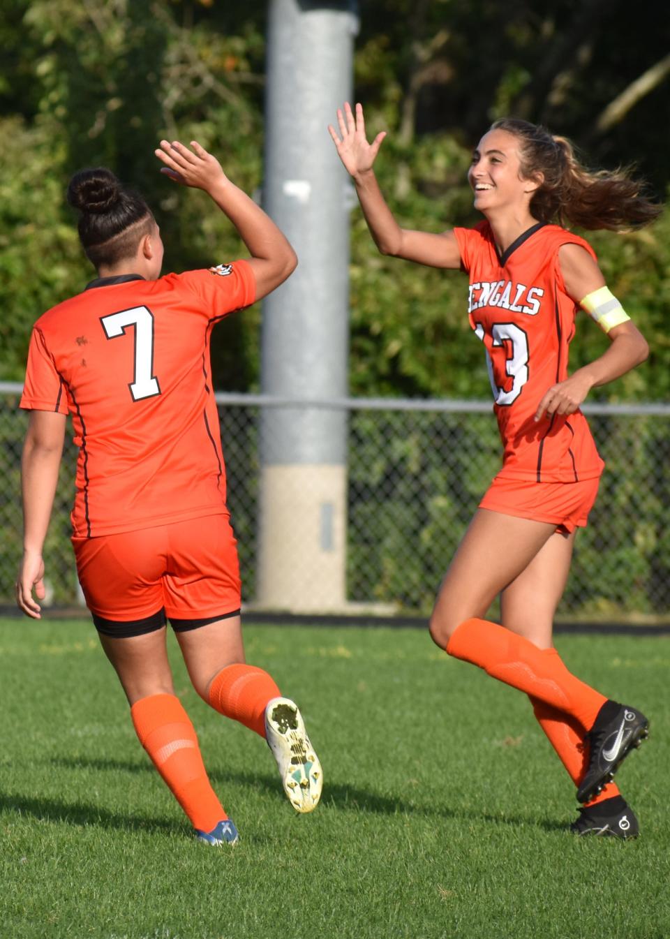 Diman's Cheyenne Brito (left) gets a high five from Dakota Valente after scoring a goal against Bristol-Plymouth.