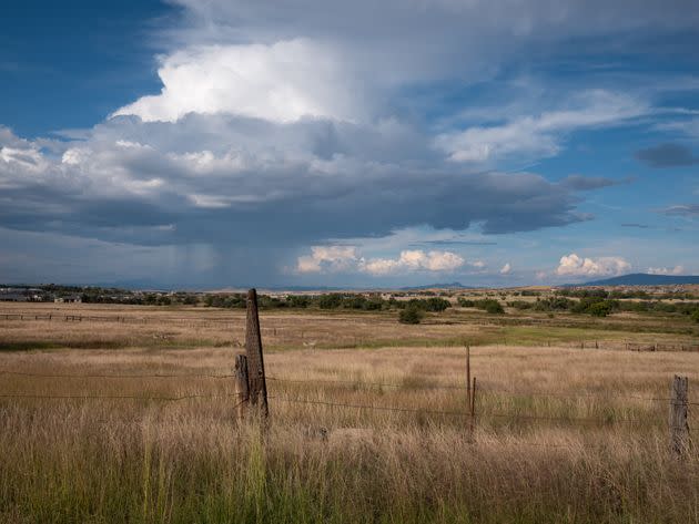 A roadside view with a distant rainstorm outside Prescott, Arizona. (Photo: Molly Peters for HuffPost)