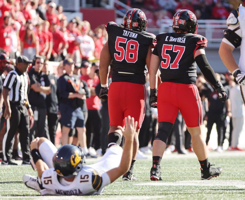 Utah Utes defensive tackle Junior Tafuna (58) and Utah Utes defensive tackle Keanu Tanuvasa (57) hurry California Golden Bears quarterback Fernando Mendoza (15) and injure him in Salt Lake City on Saturday, Oct. 14, 2023. Utah won 34-14. | Jeffrey D. Allred, Deseret News