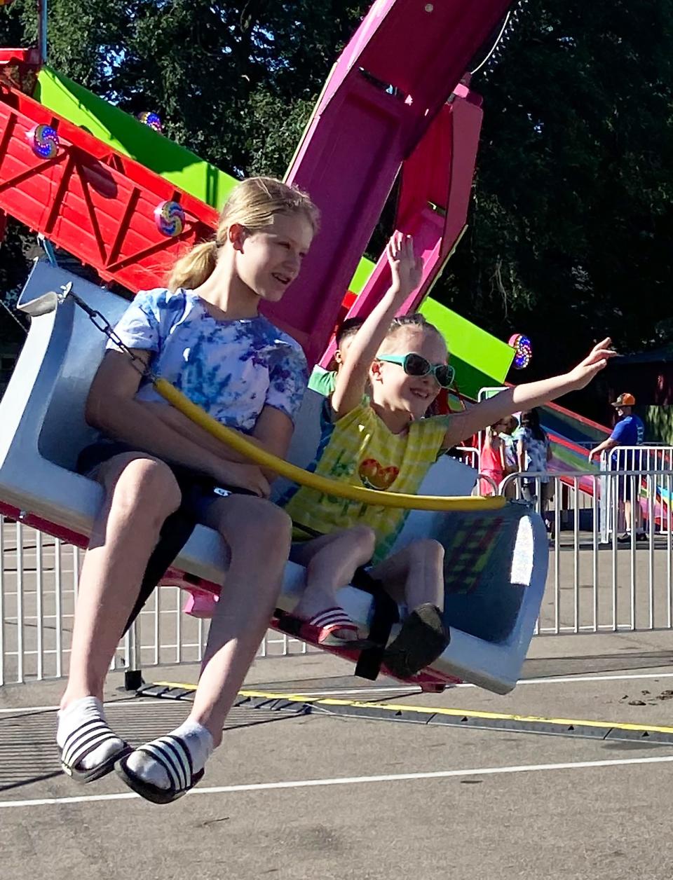 Graycee and Adelaide Cloutier enjoyed a ride Wednesday during "Family Night" at Sturgis Fest. They were having a night out after moving to the community along with their mom, Erin, and sister Ellieana.