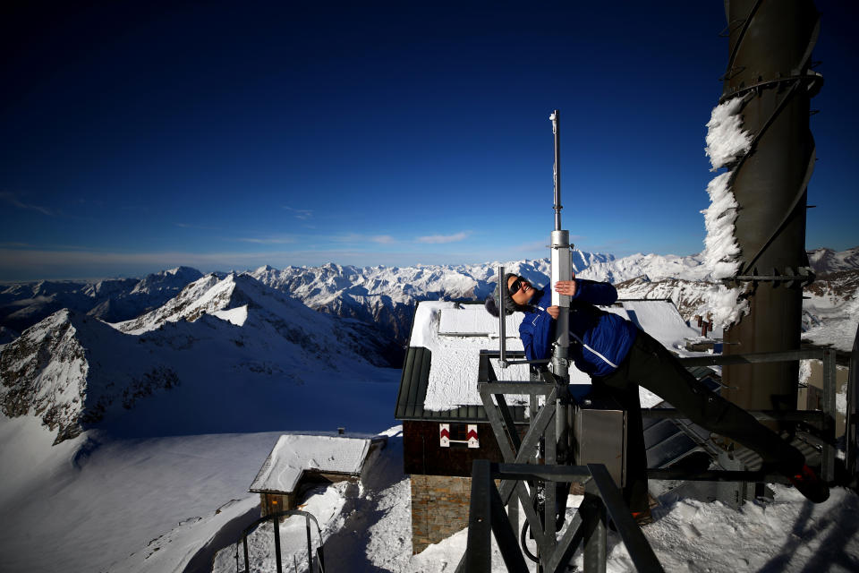 Meteorologist Elke Ludewig from the Central Institute for Meteorology and Geodynamics ZAMG, looks up an ice load scale at the Sonnblick Observatory at 3,106 meters above sea level, located in the Hohe Tauern mountain range near Rauris, Austria. (Photo: Lisi Niesner/Reuters)