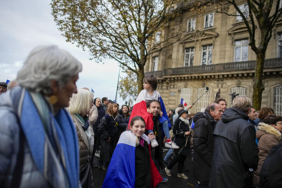 Thousands gather for a march against antisemitism in Paris, France, Sunday, Nov. 12, 2023. French authorities have registered more than 1,000 acts against Jews around the country in a month since the conflict in the Middle East began. (AP Photo/Christophe Ena)