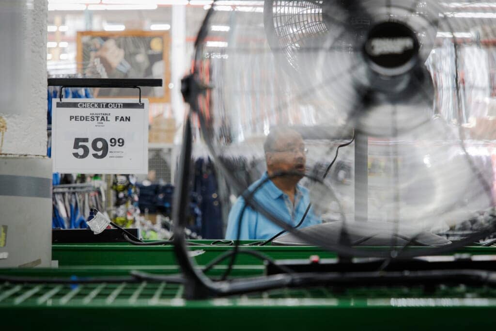 Stacks of air conditioners, fans and other cooling equipment line the entrance of McLendon Hardware in Renton, Wash., on Sunday, July 24, 2022. (Kori Suzuki/The Seattle Times via AP)