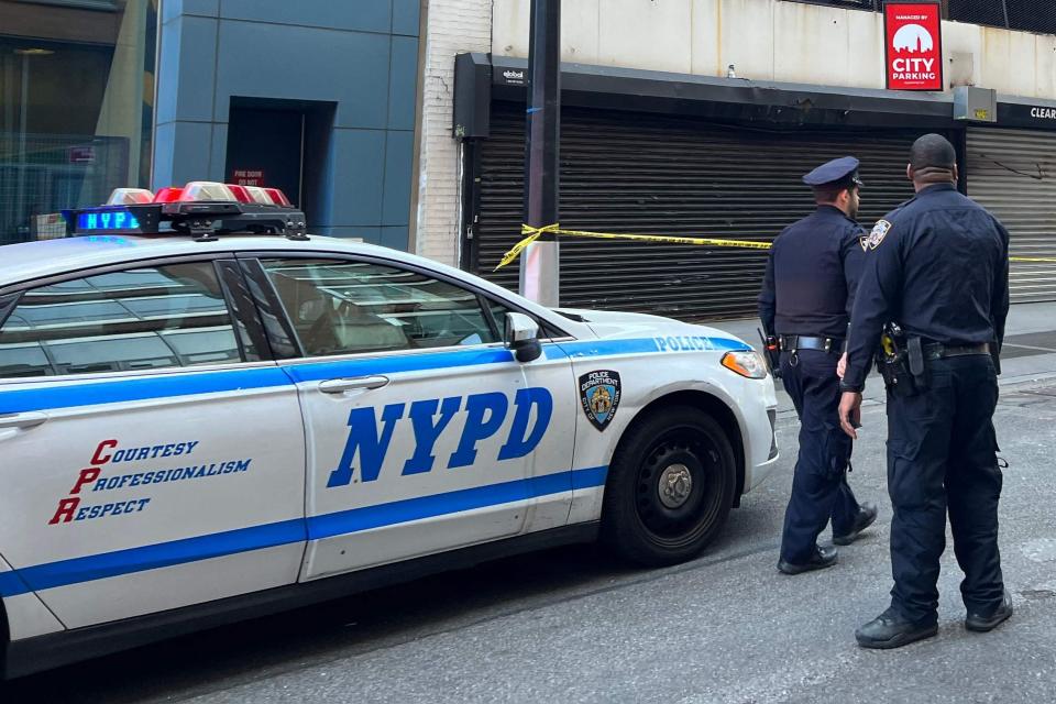 New York Police Department (NYPD) officers are seen in April 2023 in lower Manhattan. The department's 115th precinct helped shut down six massage parlors Thursday that authorities suspect were operating as brothels.