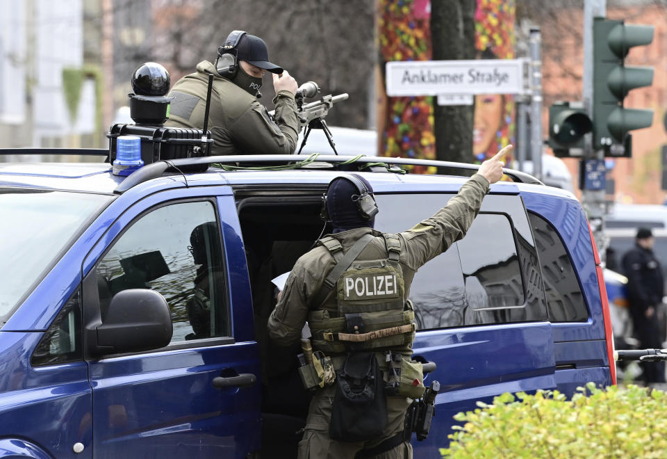 Members of an elite police unit patrol near the the Beth Zion Synagogue where a central commemoration ceremony for the 85th anniversary of the Night of Broken Glass (Kristallnacht) will take place in Berlin, Thursday, Nov. 9, 2023 in Berlin. (John MacDougall, Pool via AP)