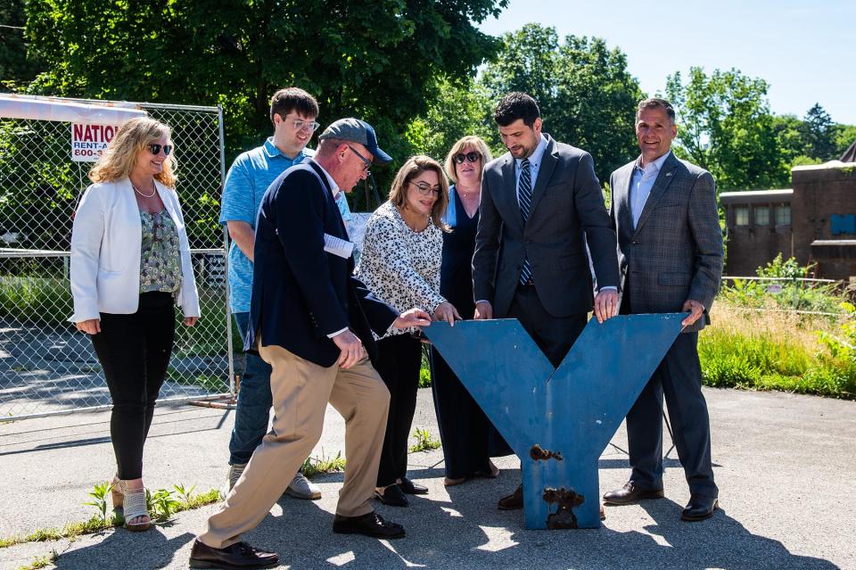 Kingston YMCA board members are presented with Y from the former Poughkeepsie YMCA building during a press conference for the start of demolition of the YMCA building in the city of Poughkeepsie, NY on Monday, June 6, 2022.