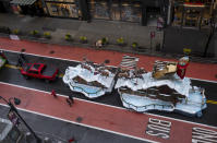 The Santa Claus float that is part of the modified Macy's Thanksgiving Day Parade is seen from the Empire State Building in New York, Thursday, Nov. 26, 2020. Due to the pandemic, crowds of onlookers were not allowed to attend the annual parade. (AP Photo/Craig Ruttle)